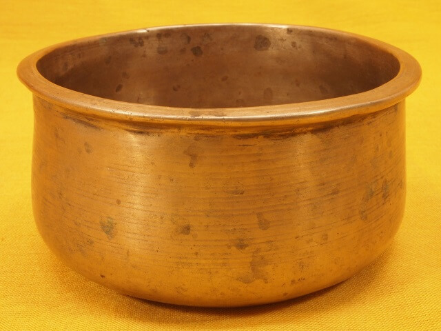 Antique Trapezoid Singing Bowl with steady metallic overtone.