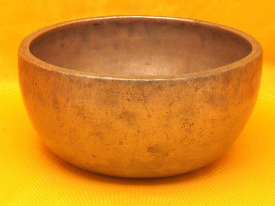 XX Thick Antique Thadobati Singing Bowl with softly playing notes.