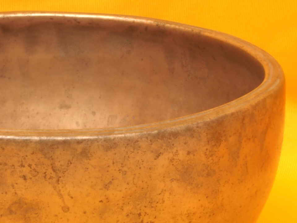 XX Thick Antique Thadobati Singing Bowl with softly playing notes.