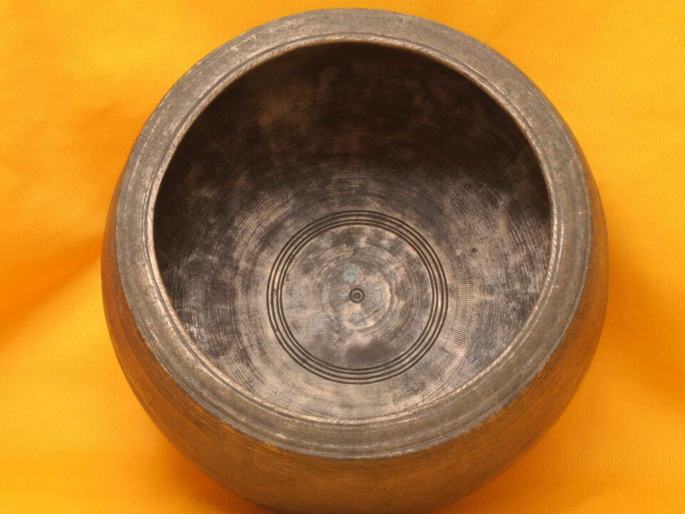 XX Thick Huge Antique Mani Singing Bowl with lots of worn artwork.
