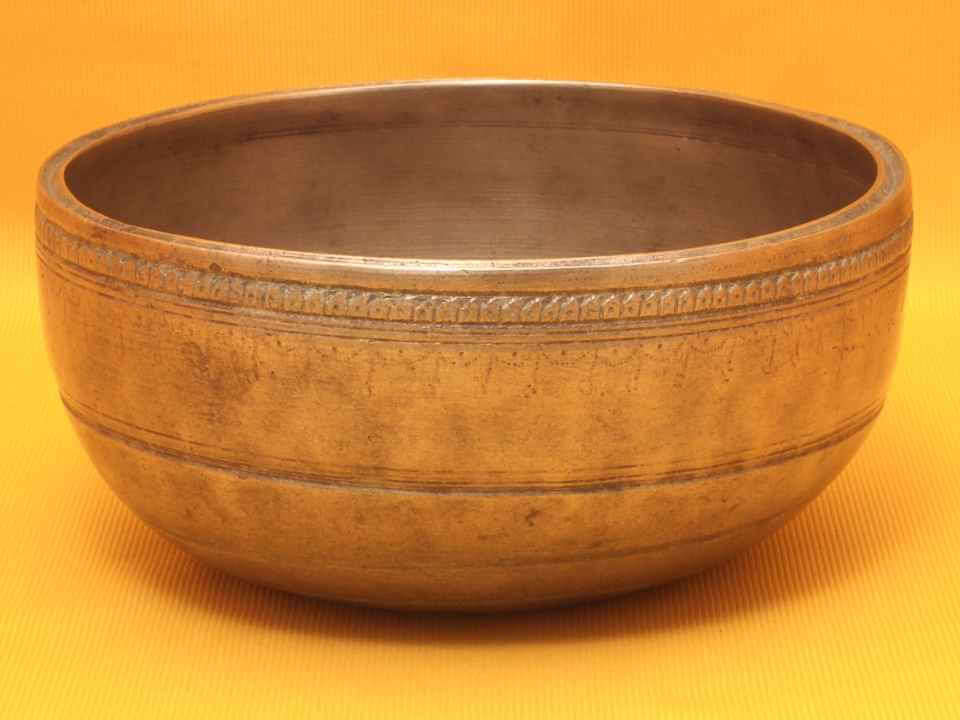 Adorned Antique Thadobati Singing Bowl with powerful complex initial sound