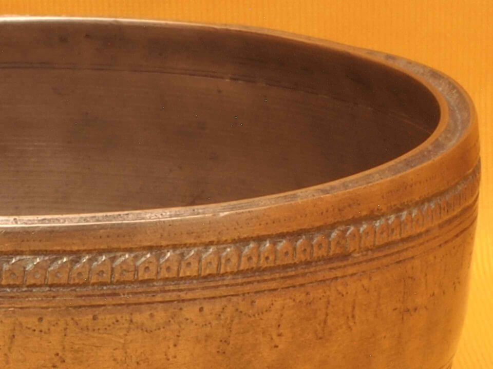 Adorned Antique Thadobati Singing Bowl with powerful complex initial sound