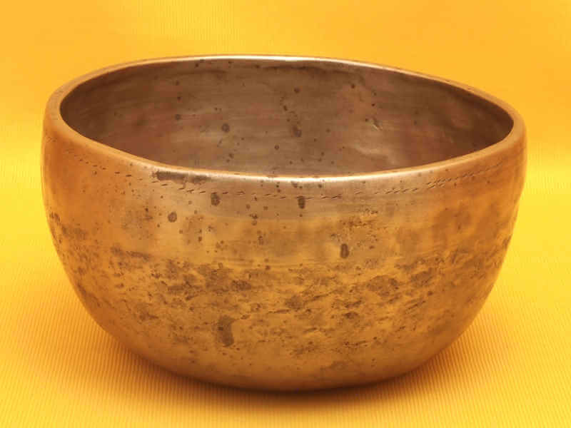 Small Thick Antique Thadobati Singing Bowl with a solid singing high