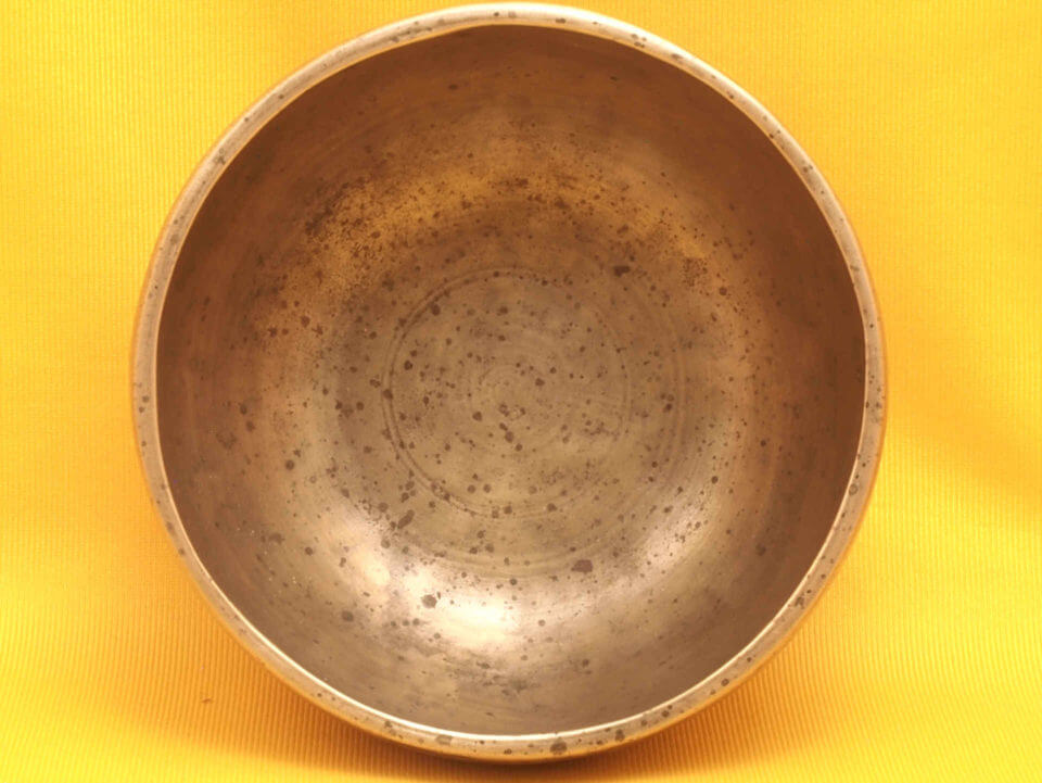 Small Thick Antique Thadobati Singing Bowl with a solid singing high